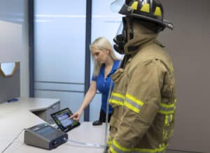 Firefighter undergoing quantitative respirator fit testing with AccuFit™