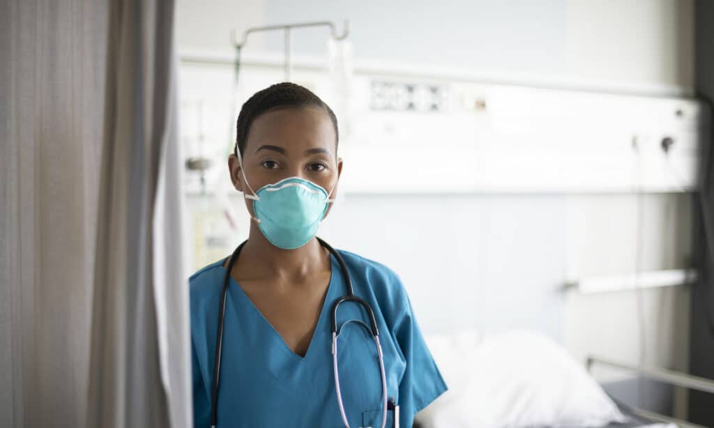 Healthcare worker in a filter facepiece respirator with proper face fit