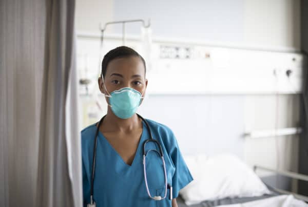 Healthcare worker with a disposable N95 facemask respirator